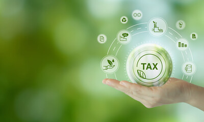 Environmental tax breaks concept. Holding glass ball with green tax icons. Using environmental  taxes, carbon tax, environmentally beneficial tax incentives in order to achieve environmental targets. - obrazy, fototapety, plakaty