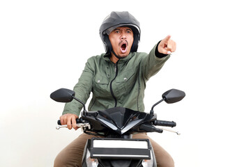 Angry asian man shouting and pointing while driving a motorcycle. Isolated on white background
