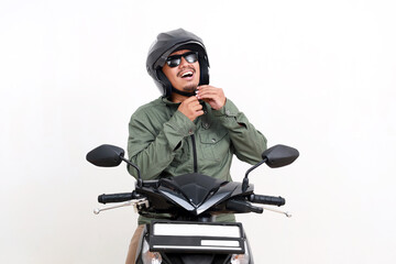 Asian man wearing helmet while sitting on the motorcycle. Isolated on white background