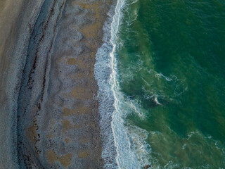Sand and green waves texture seen from above texture