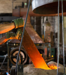 Ferrous metal billet is melted in an induction furnace closeup