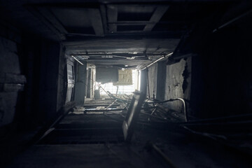 Indian yard well bottom up view to light on roof, narrow shaft yard with windows opposite each other