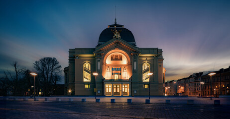 historical theater building in a night city in Europe - obrazy, fototapety, plakaty