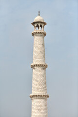 Minaret of Taj Mahal white marble mausoleum landmark in Agra, Uttar Pradesh, India, white tower
