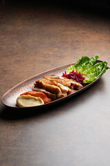 Fried chicken breast and mashed potato with tomato sauce
