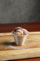 Chocolate muffin in a cup on the table food photography