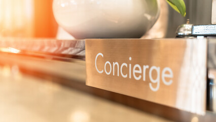 Concierge service, reception desk counter at frontdesk of hotel with hospitality staff team working...