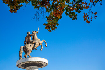 Skopje Macedonia Alexander the Great monument with autumn leaves