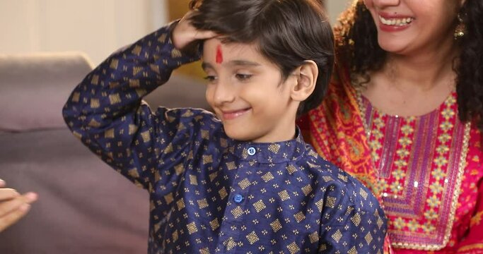 Sister applying tilak to her brother at Raksha Bandhan
