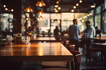 Fotobehang Blurred background. Retro cafe bar in modern decor. Bokeh ambiance. Abstract urban dining lifestyle at night. Vintage wooden counter. Bar design © Thares2020