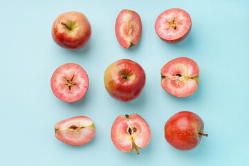 Sweet pink apples on blue background
