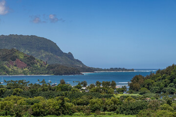The view from the Hanalei Bay Lookout of the lush valley, mountains and the Pacific Ocean in Kauai, Hawaii, United States. 
