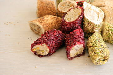 Rolls of turkish delight with different flavors and fillings close up on table. Turk Lokumu bars