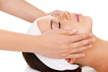Fototapeta na wymiar Face, hands and facial massage with a woman customer in studio isolated on a white background for stress relief. Spa, luxury treatment and a young person at the salon for health, wellness or to relax
