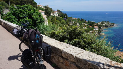 A bicycle in front of the view of the Baie de Saint-Laurent in Cap d'Ail in the departement...
