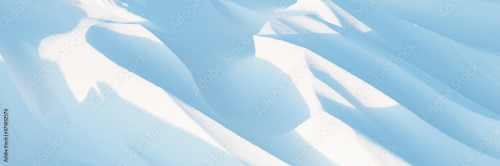 Wall mural snow texture. wind sculpted patterns on snow surface. wind in the tundra and in the mountains on the