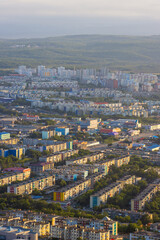 Morning cityscape. Top view of the buildings and streets of the city. Residential urban areas at sunrise. Beautiful aerial city landscape. Petropavlovsk-Kamchatsky, Kamchatka Krai, Far East of Russia.