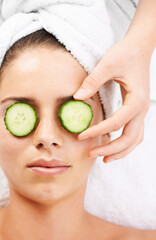 Obraz na płótnie Canvas Woman, hand and cucumber on eyes for wellness, cosmetic or spa therapy with closeup, relax and peace. Person, skincare or detox treatment for beauty, skin or stress relief and relaxation or wellbeing