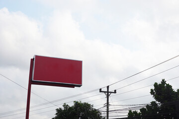 Horizontal red empty signage under sky