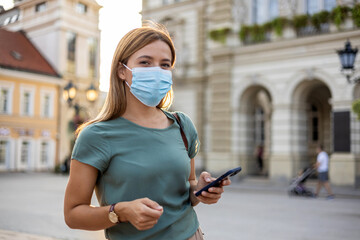 Covid face mask, phone gps and woman on the internet in a road for location in the urban city....