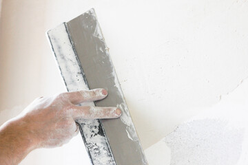 spatula repair work in male hands