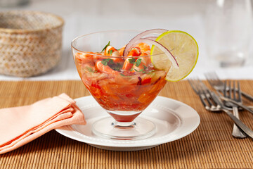 Peruvian shrimp ceviche, a traditional appetizer. served in an elegant glass