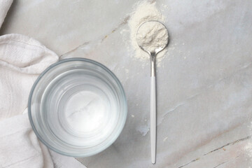 White powder in the spoon. Collagen protein powder or wheat flour. Concept of nutritional supplement, dieting, detox, preventive healthcare and healthy lifestyle.