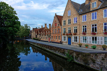 Fototapeta na wymiar Bruges Belgium - 08 01 2023: Historic city center of Brugge, West Flanders province. Ancient medieval architecture of Bruges old town. Canals and stone paving streets cityscape with famous Burg Berg