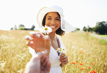Woman, flowers and countryside with a gift, nature and plants with vacation, summer and relax....