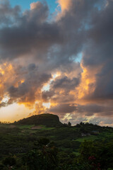 Evening view of ridge with dramatic clouds near Kilauea, Kauai, Hawaii, United States.
