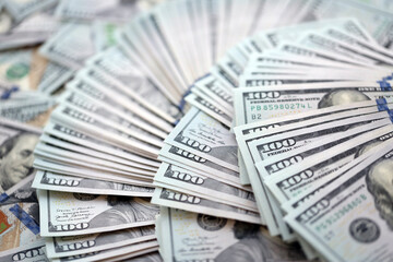 Very big amount of US hundred dollar bills close up. Huge quantity of united states currency notes on flat table