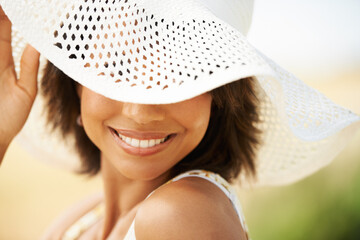 Face, summer hat or happy woman in park, nature or outdoor field for freedom or peace on break. Smile, wellness or female person in countryside for fresh air on holiday vacation or travel for fashion