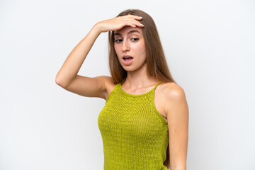 Young caucasian woman isolated on white background doing surprise gesture while looking to the side