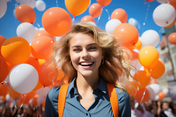 Happy Dutch girl with orange ballons in Netherlands Kingdom Day - obrazy, fototapety, plakaty