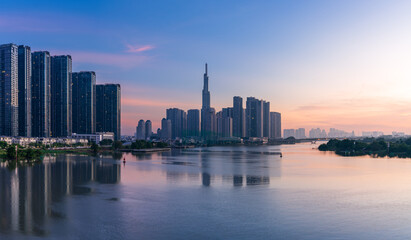 Fototapeta na wymiar Landmark 81 and other modern buildings are brilliant at the dawn in Ho Chi Minh city.