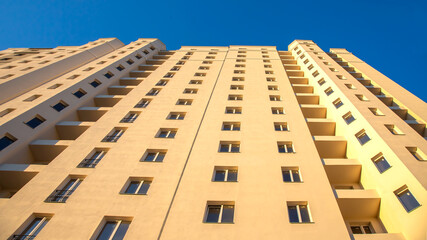 Facade of a new multi-story residential building. architecture and modern construction