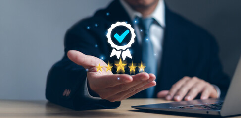 Concept Standard Quality Control QA,Certification ,Assurance, Guarantee , businessman show best quality assurance QC and standardization of corporate business on hand