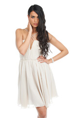 Portrait, fashion and serious woman in dress in studio isolated on a white background. Confident, model and person in formal clothes, elegant or trendy style for party, prom or luxury event in Brazil