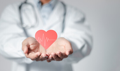Cardiologist doctor holding heartbeat icon for checking the function of the patient heart. medical check up, heart attack, cardiology, help from specialist.