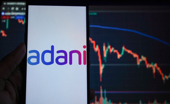 Adani logo with negative stock market logo in background 