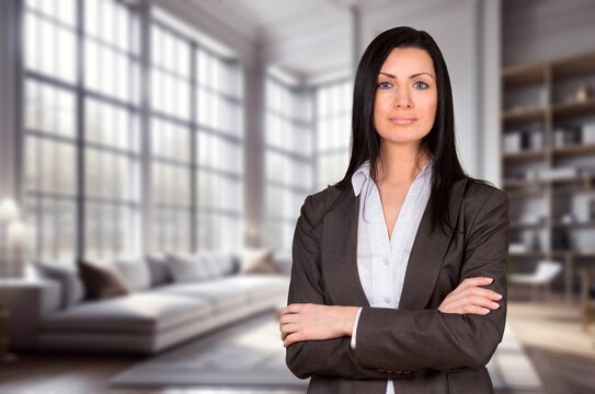Confident young business woman with arms crossed in the office, AI generated image