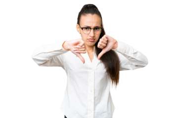 Young Arabian woman over isolated chroma key background showing thumb down with two hands