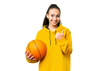 Obraz premium Young Arabian woman playing basketball over isolated wall over isolated chroma key background giving a thumbs up gesture