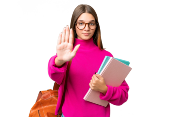 Teenager student caucasian girl over isolated background making stop gesture