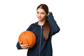 Teenager caucasian girl playing basketball over isolated background having doubts