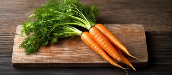 A wooden board with an organic and textured background showcases the vibrant colors of a healthy orange carrot symbolizing its natural and nutritious qualities as a green plant based food o