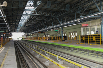 A view of an empty overhead metro train station under construction