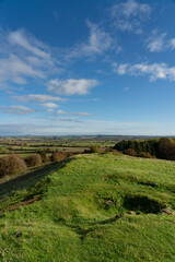 Vista from Burton Dassett Hills on a bright autumnal day with far reaching views over Warwickshire, England - 674722738