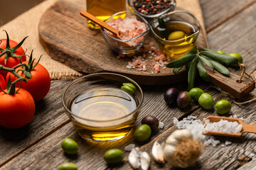 olive oil and on wooden background