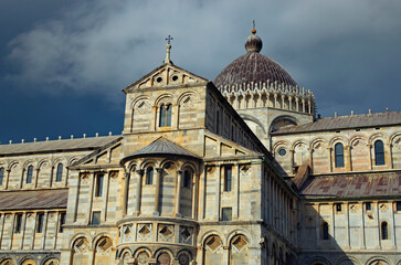 Detailed view of ancient Pisa Cathedral against stormy sky and gloomy clouds. Notable landmark of Pisa, Italy. UNESCO World Heritage Site